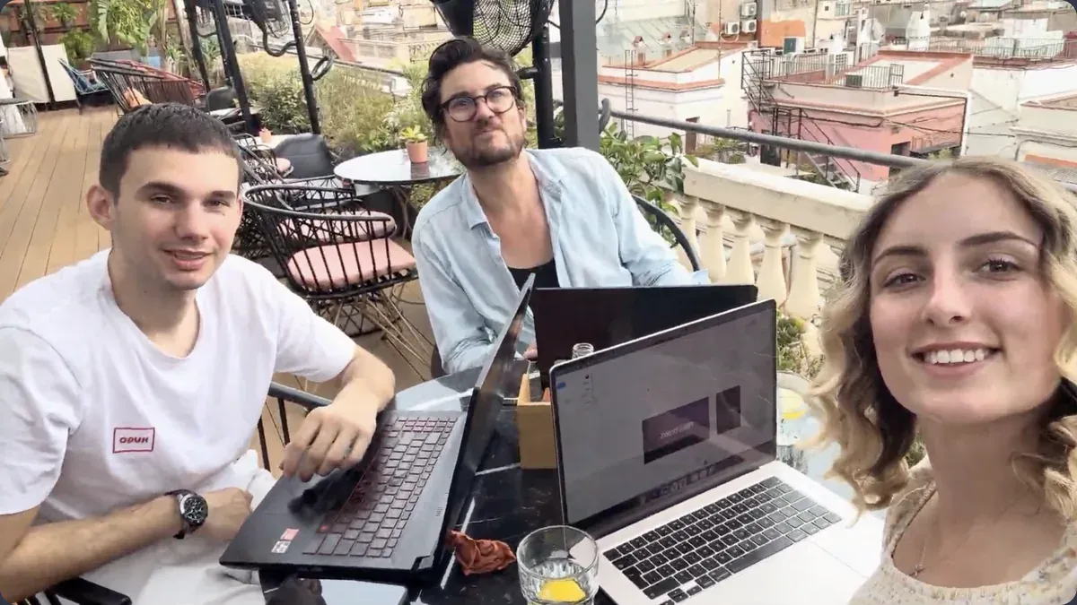 Three of the team working from a terrace in Barcelona
