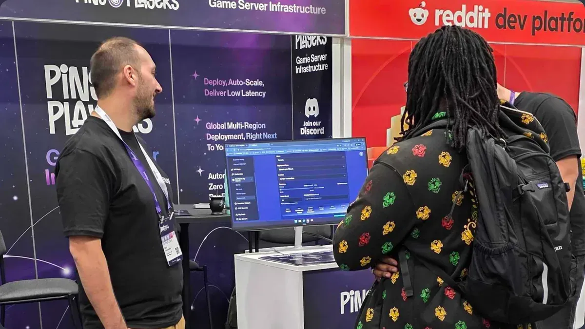 A team member giving a demo to a visitor at GDC 2026