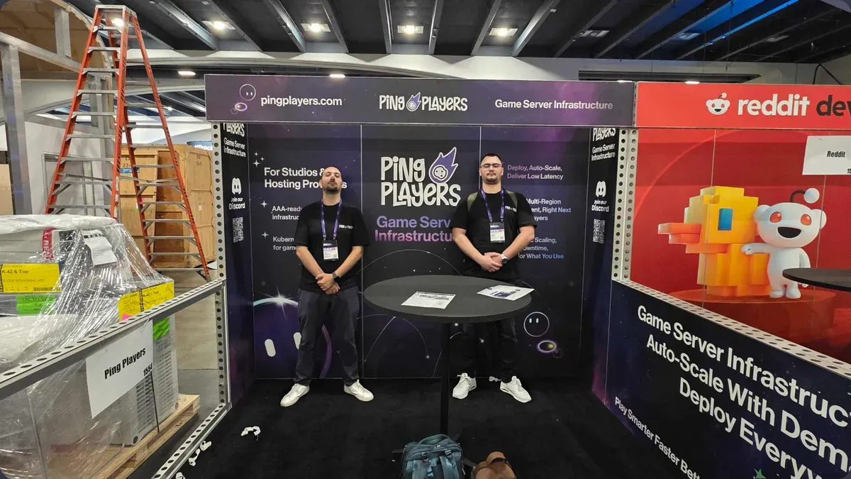 Two of the team at the PingPlayers stand at GDC 2026 before the doors open